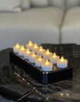 Set aus 12 luxuriösen wiederaufladbaren LED-Teelichtern